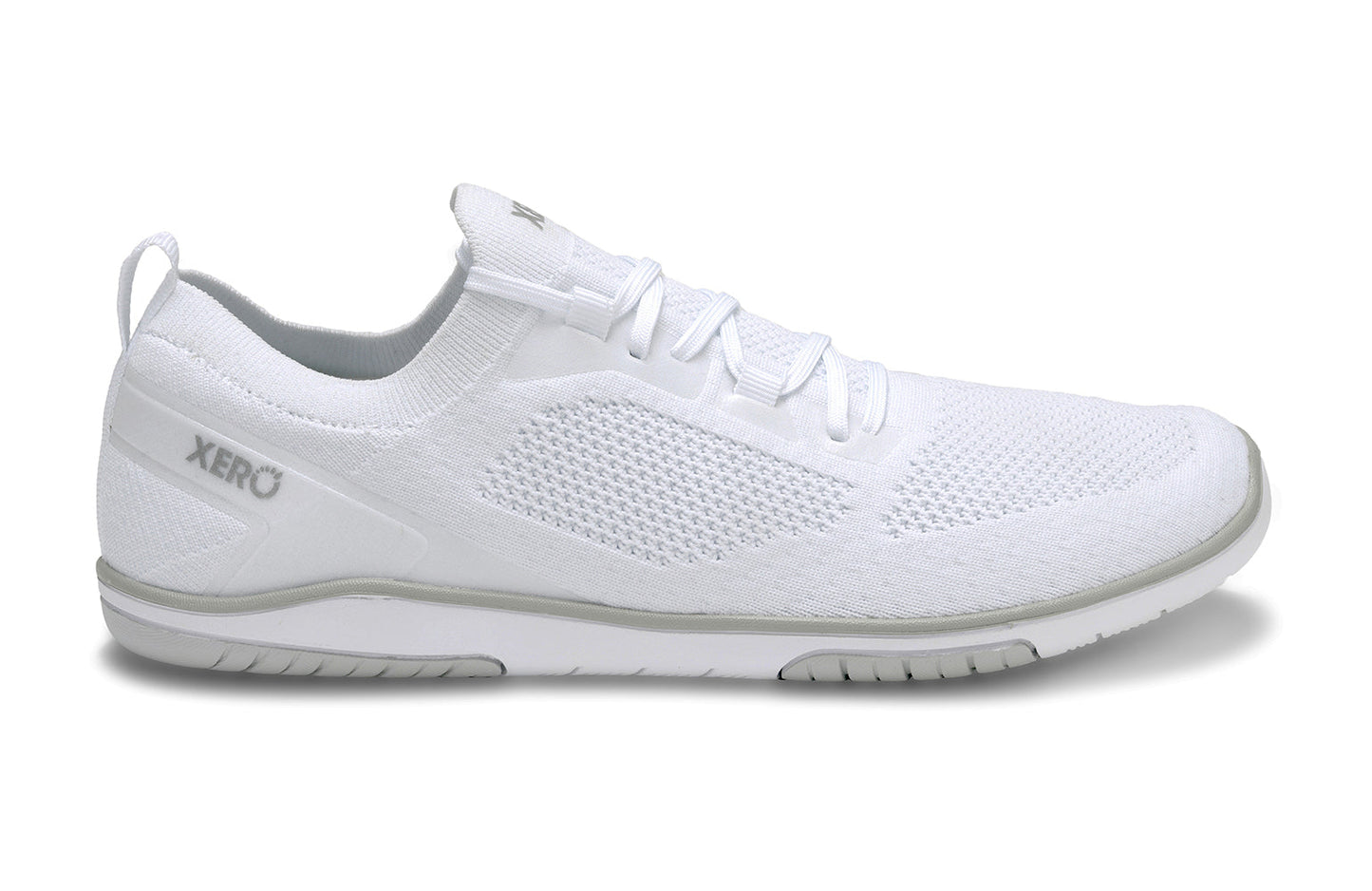 Xero Shoes Canada, specifically barefoot running shoes Canada. These minimalist shoes have flexible soles, wide toe boxes, and zero drop. Side lateral view of Xero Men's Nexus Knit in White. An athletic, comfortable shoe.