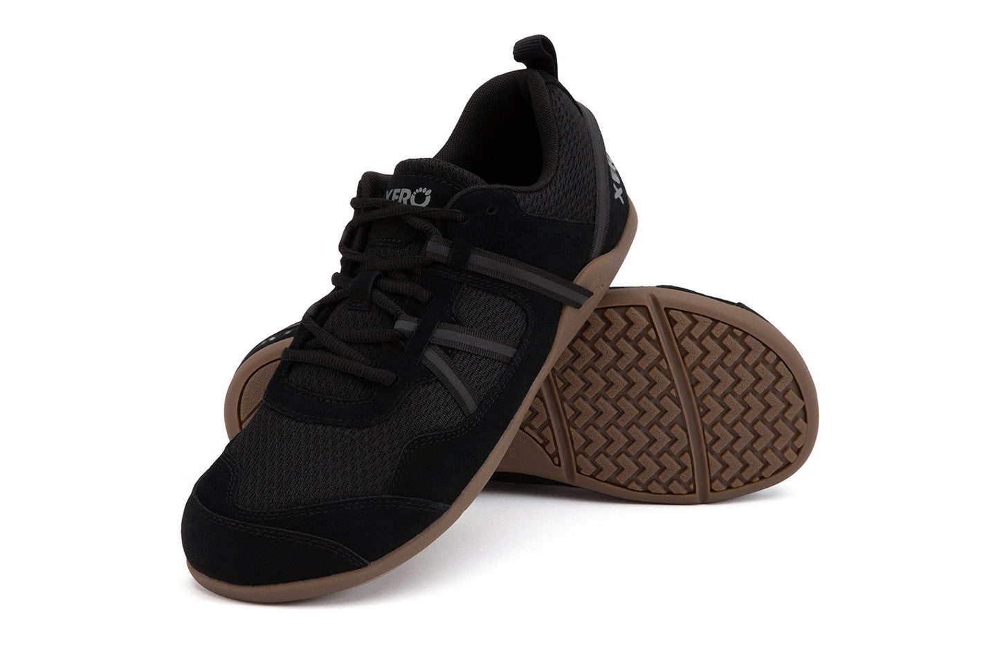 Xero Barefoot Shoes sold in Ontario, Canada. These minimalist shoes have flexible soles, wide toe boxes, and zero drop. Angled pair view of Xero Men's Prio Suede in Black Gum. All-purpose "do anything" shoe.