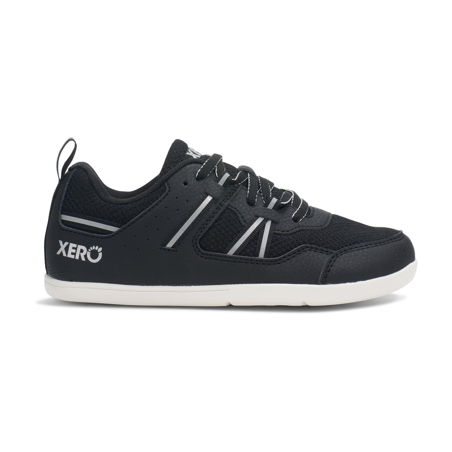 Xero Barefoot Shoes for kids sold in Ontario, Canada. These minimalist shoes have flexible soles, wide toe boxes, and zero drop. Lateral side view of Xero Kid's Prio in Black/White. Casual kid's sneaker.