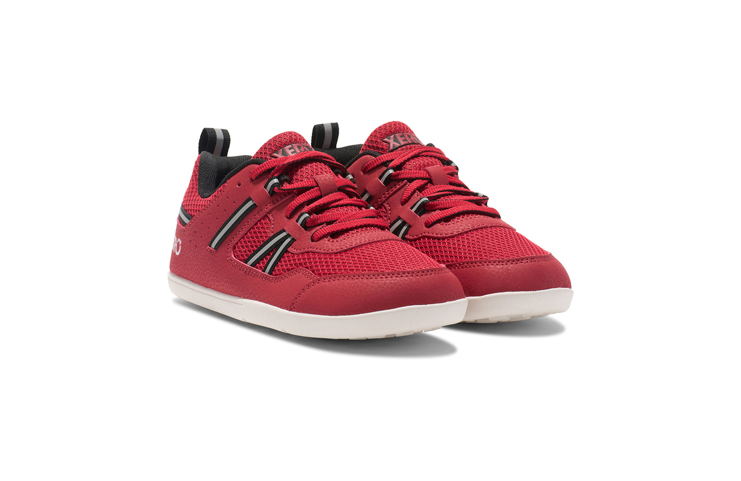 Xero Barefoot Shoes for kids sold in Ontario, Canada. These minimalist shoes have flexible soles, wide toe boxes, and zero drop. Angled view of Xero Kid's Prio in Salsa Red/Black. Casual kid's sneaker.