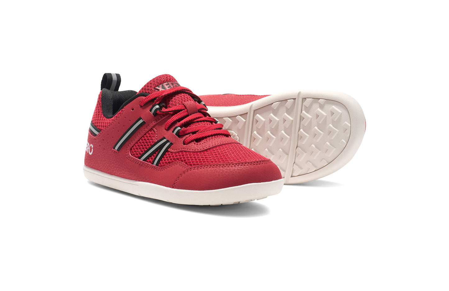 Xero Barefoot Shoes for kids sold in Ontario, Canada. These minimalist shoes have flexible soles, wide toe boxes, and zero drop. Pair view of Xero Kid's Prio in Salsa Red/Black. Casual kid's sneaker.
