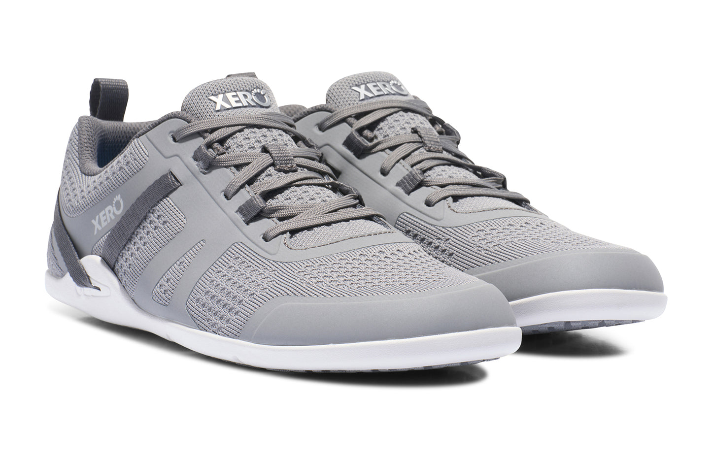 Xero Shoes Canada, specifically barefoot running shoes Canada. These minimalist shoes have flexible soles, wide toe boxes, and zero drop. Angled view of Xero Men's Prio Neo in Alloy. Shoes made for performance and comfort.