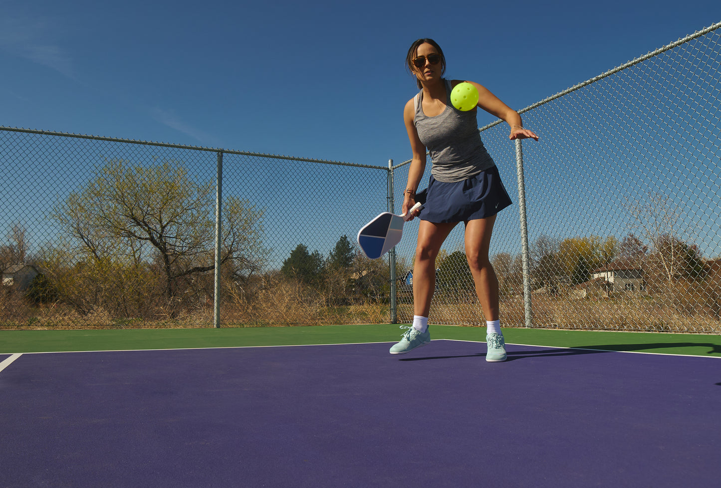 Xero Shoes Canada, specifically barefoot running shoes Canada. Woman wearing Prio Neo on a court