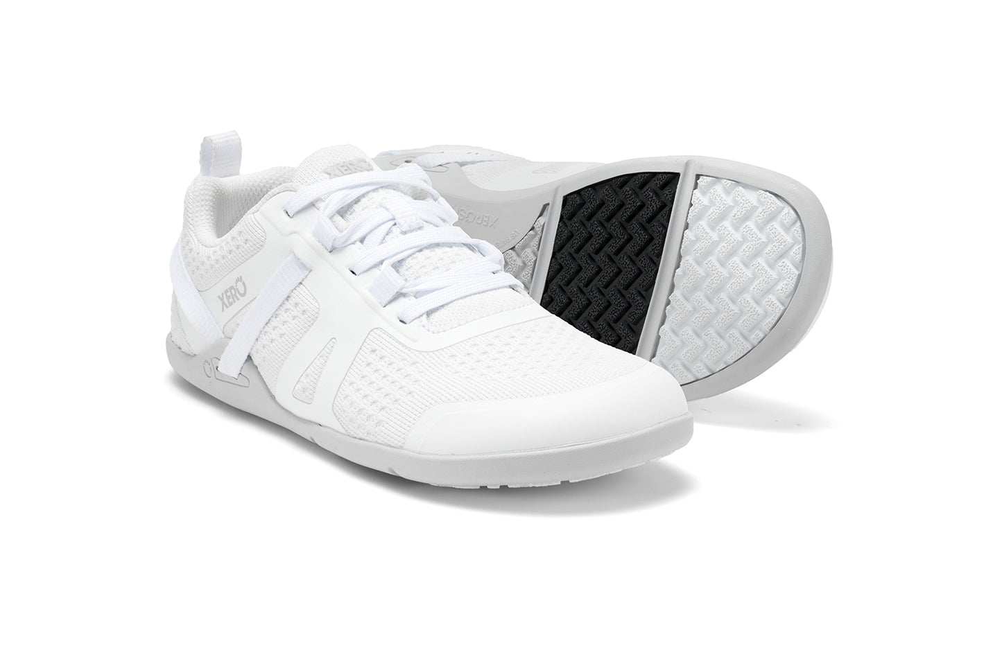 Xero Shoes Canada, specifically barefoot running shoes Canada. These minimalist shoes have flexible soles, wide toe boxes, and zero drop. Pair view of Xero Women's Prio Neo in White. Shoes made for performance and comfort.