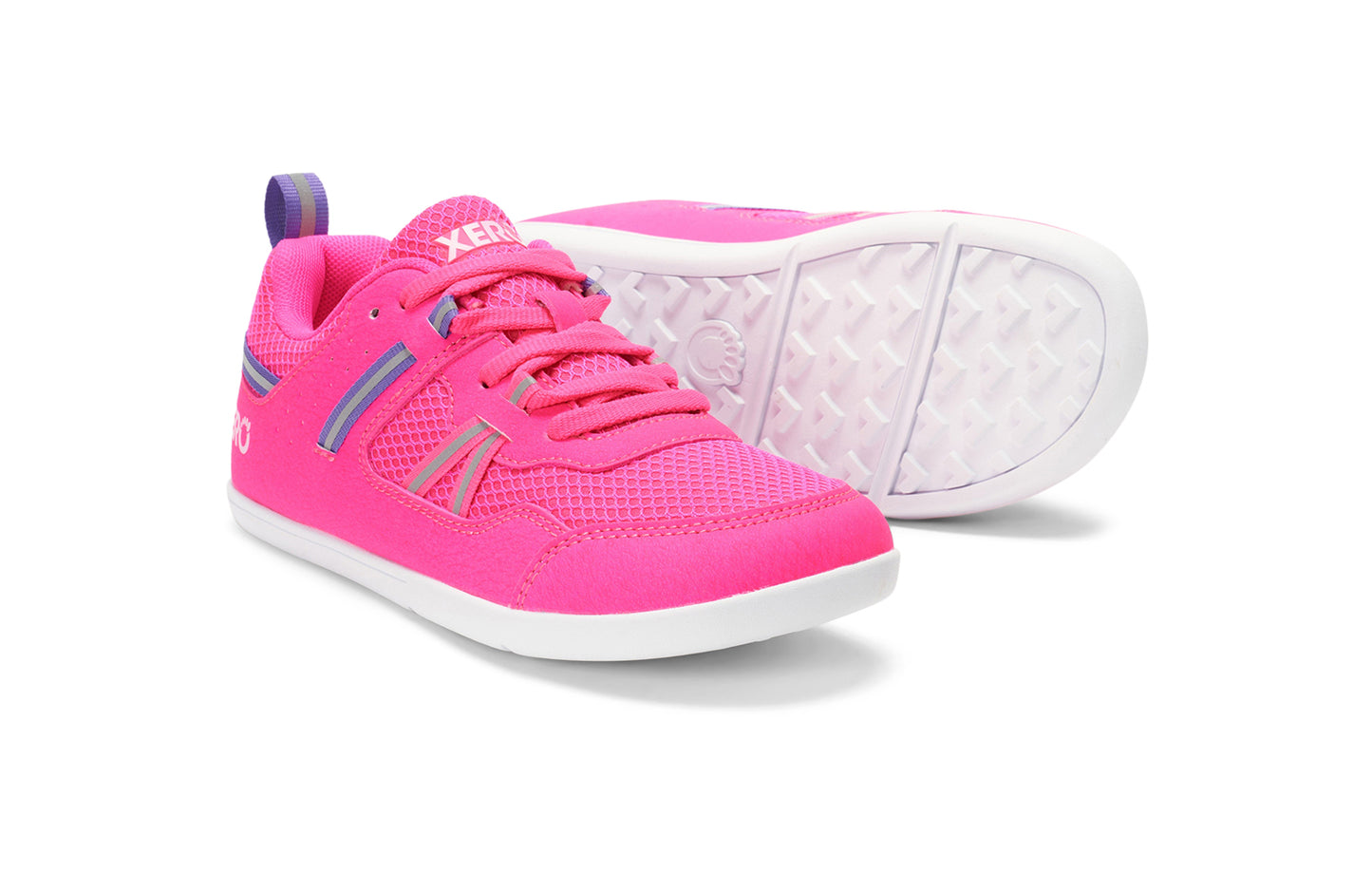 Xero Barefoot Shoes for kids sold in Ontario, Canada. These minimalist shoes have flexible soles, wide toe boxes, and zero drop. Pair view of Xero Kid's Prio in Pink. Casual kid's sneaker.