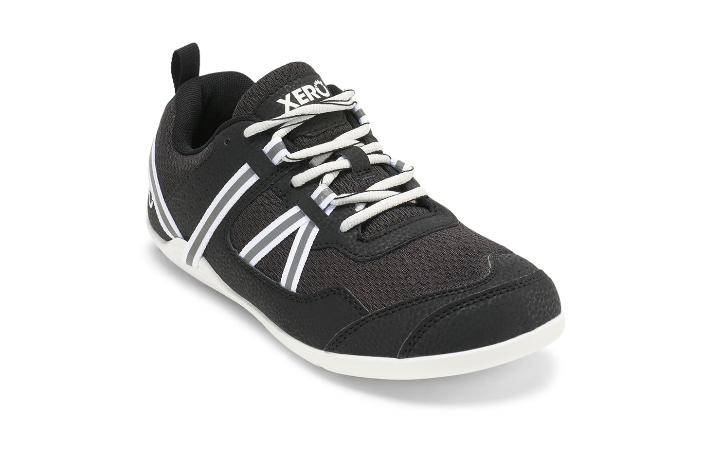 Xero Shoes Canada, specifically women’s barefoot shoes Canada. These minimalist shoes have flexible soles, wide toe boxes, and zero drop. Angled view of Xero Women's Prio in Black/White. A running and fitness shoe.