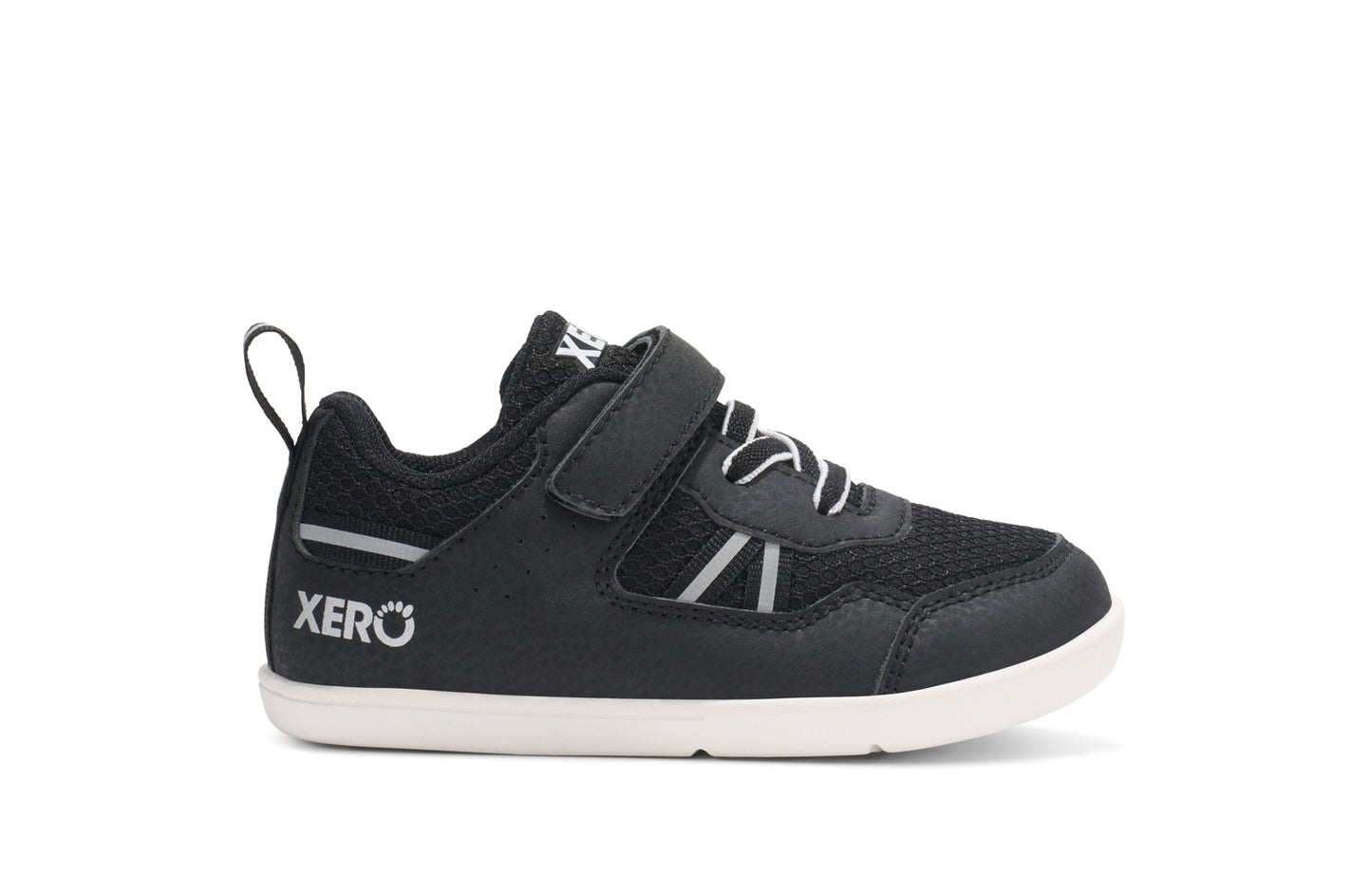 Xero Barefoot Shoes for little kids sold in Ontario, Canada. These minimalist shoes have flexible soles, wide toe boxes, and zero drop. Side view of Xero Little Kid's Prio in Black/White. Casual kid's sneaker.