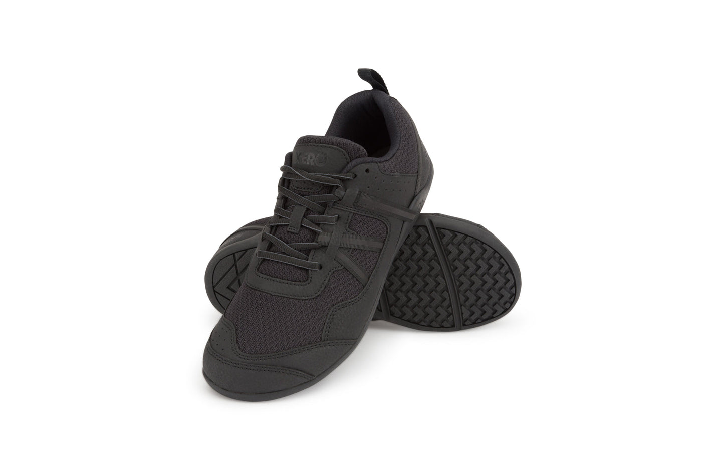 Xero Barefoot Shoes sold in Ontario, Canada. These minimalist shoes have flexible soles, wide toe boxes, and zero drop. Angled side view of Xero Men's Prio in Black. A running and fitness shoe.