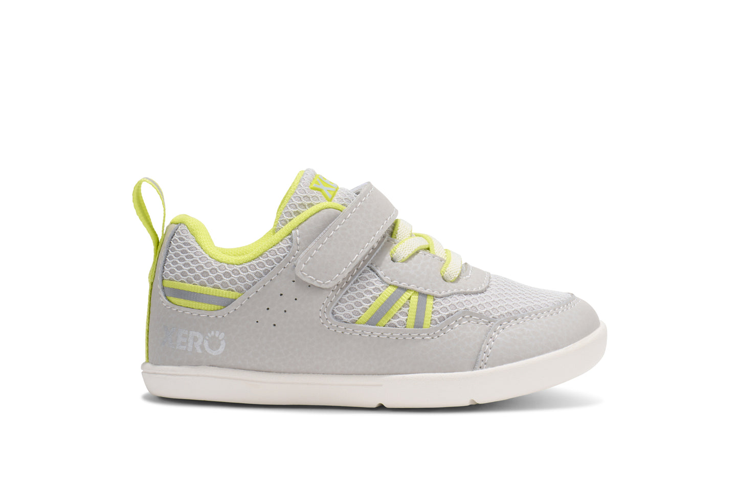 Xero Barefoot Shoes for little kids sold in Ontario, Canada. These minimalist shoes have flexible soles, wide toe boxes, and zero drop. Side view of Xero Little Kid's Prio in Sunnny Lime. Casual kid's sneaker.