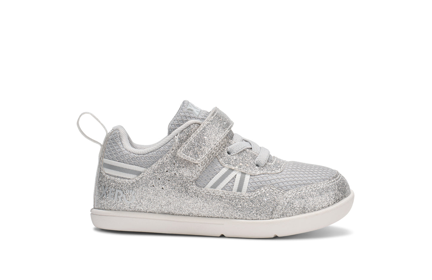 Xero Barefoot Shoes for little kids sold in Ontario, Canada. These minimalist shoes have flexible soles, wide toe boxes, and zero drop. Side view of Xero Little Kid's Prio in Silver Glitter. Casual kid's sneaker.