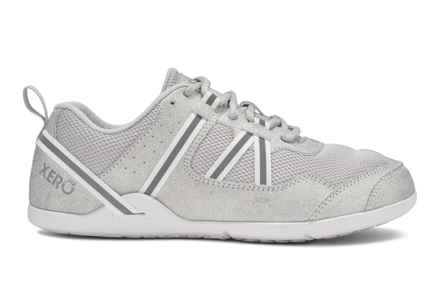 Xero Shoes Canada, specifically women’s barefoot shoes Canada. These minimalist shoes have flexible soles, wide toe boxes, and zero drop. Side view of Xero Women's Prio in Silver Glitter. A running and fitness shoe.