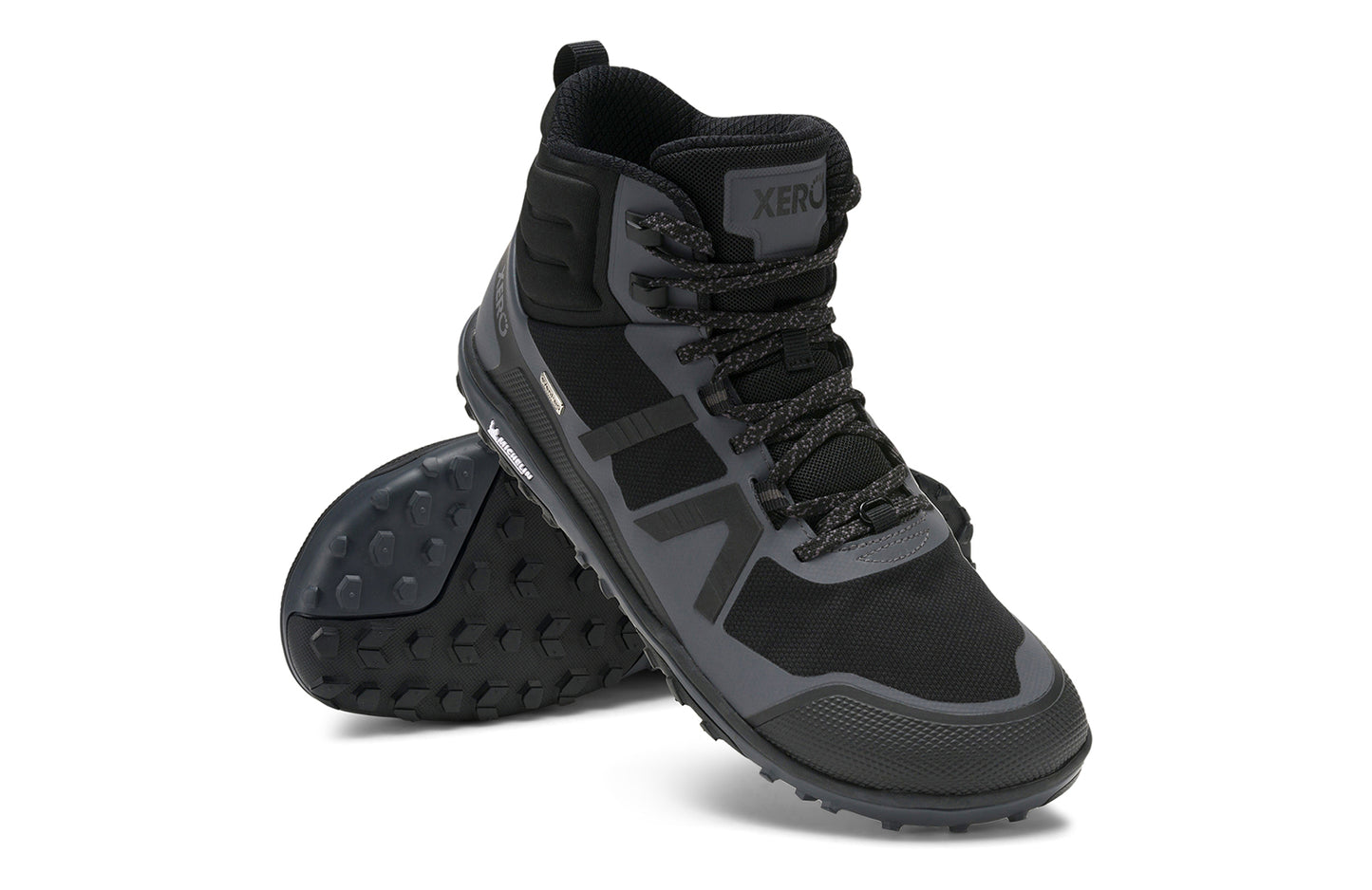 Xero Barefoot Shoes sold in Ontario, Canada. These minimalist shoes have flexible soles, wide toe boxes, and zero drop. Angled pair view of Xero Men's Scrambler Mid II WP in Black/Asphalt, a lightweight waterproof hiking shoe.