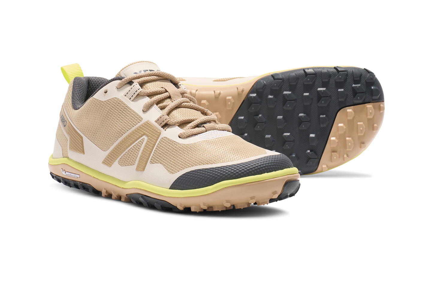 Xero Barefoot Shoes sold in Ontario, Canada. These minimalist shoes have flexible soles, wide toe boxes, and zero drop. Angled and sole view of Xero Women's Scrambler Low EV in Irish Cream/Sunny Lime, a lightweight high-performance trail runner