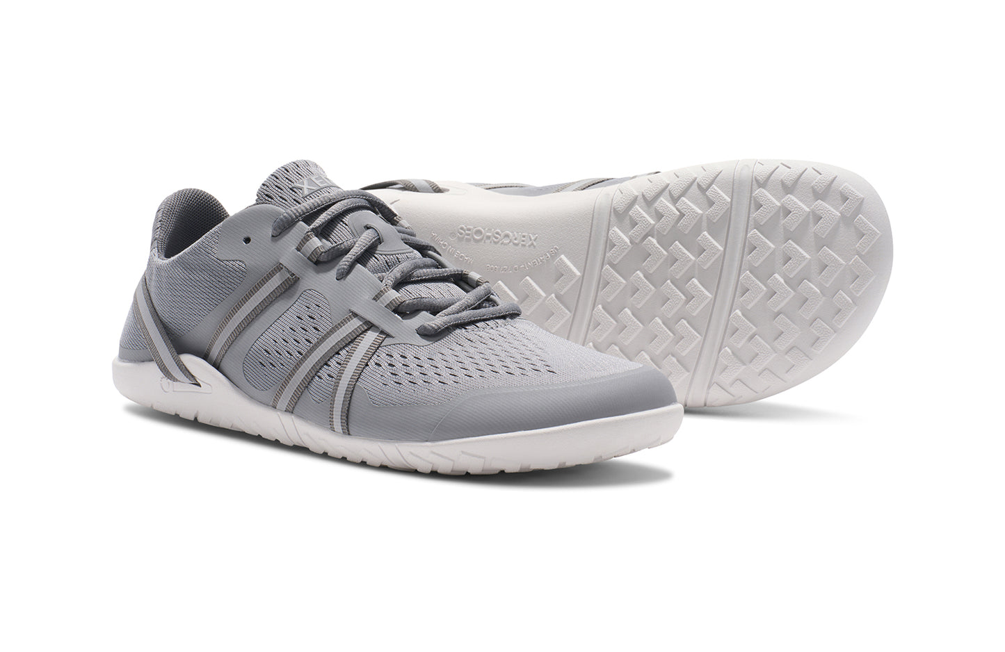 Xero Barefoot Shoes sold in Ontario, Canada. These minimalist shoes have flexible soles, wide toe boxes, and zero drop. Side and sole pair view of Xero Women's Speed Force II in Alloy Silver. Running and speed training shoe.