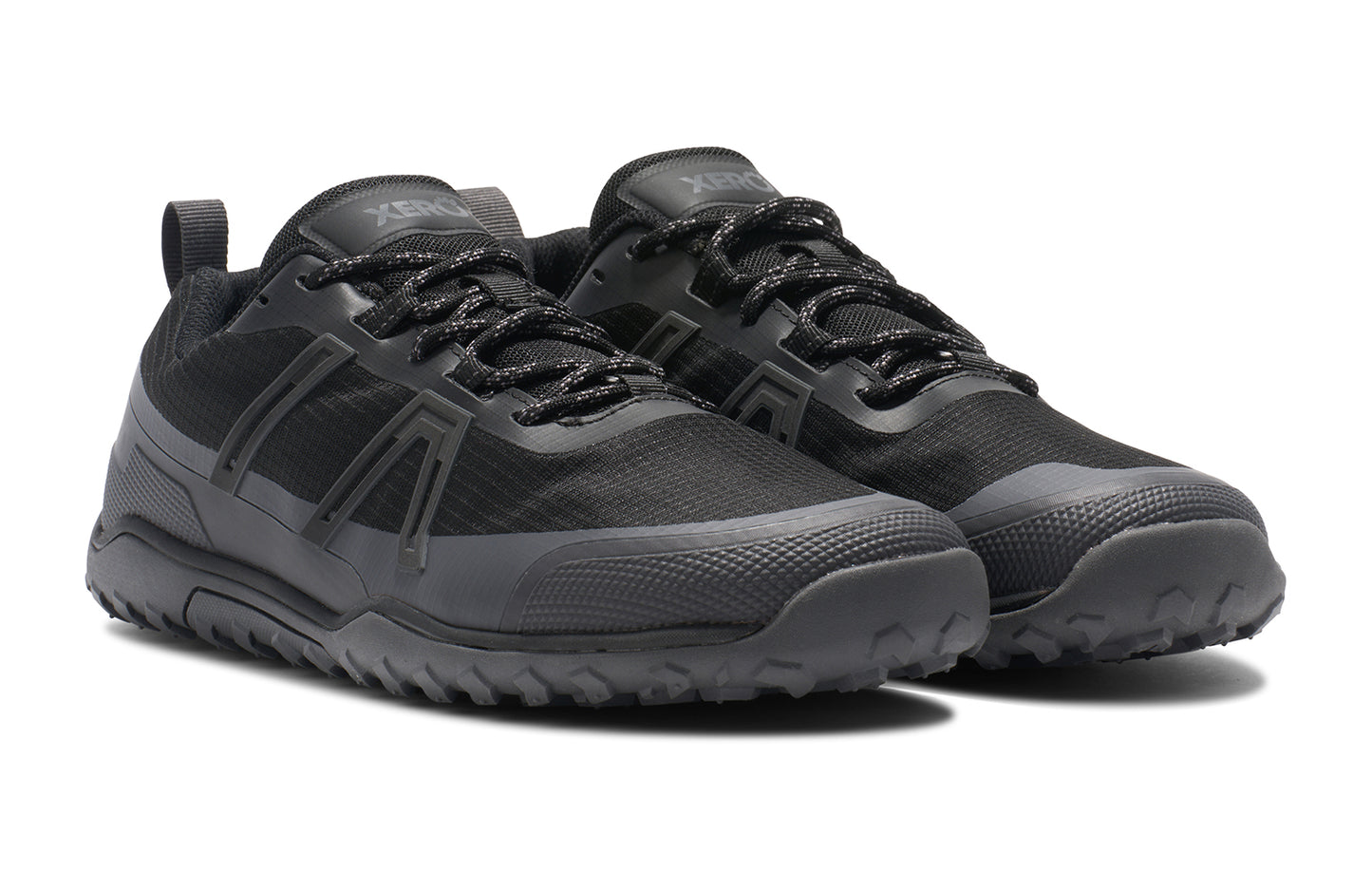 Xero Barefoot Shoes sold in Ontario, Canada. These minimalist shoes have flexible soles, wide toe boxes, and zero drop. Angled view of Xero Men's Scrambler Trail Low WP in Black Asphalt, a sturdy hiking shoe