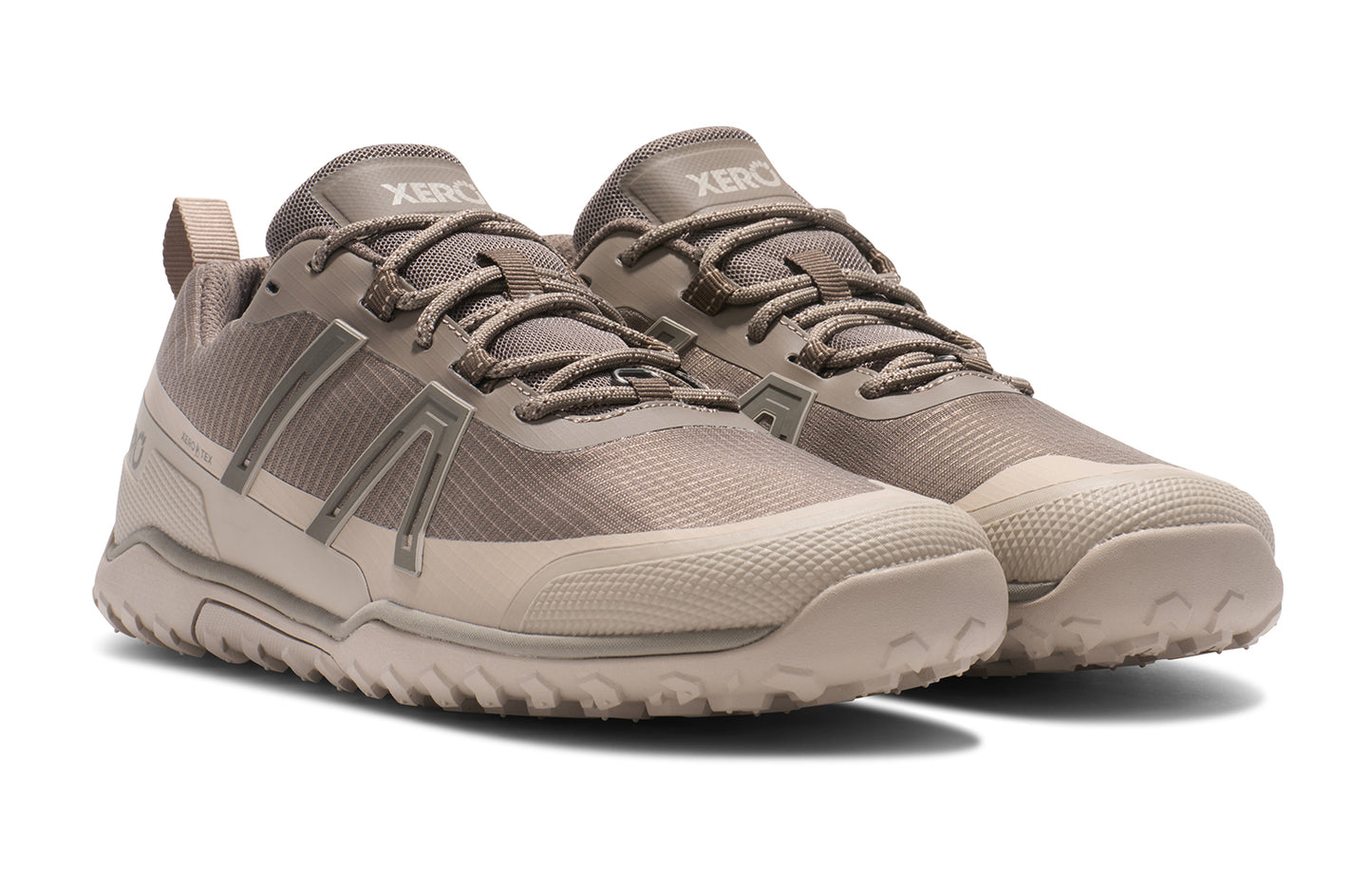 Xero Barefoot Shoes sold in Ontario, Canada. These minimalist shoes have flexible soles, wide toe boxes, and zero drop. Angled pair view of Xero Men's Scrambler Trail Low WP in Morel/Pure Cashmere, a sturdy hiking shoe
