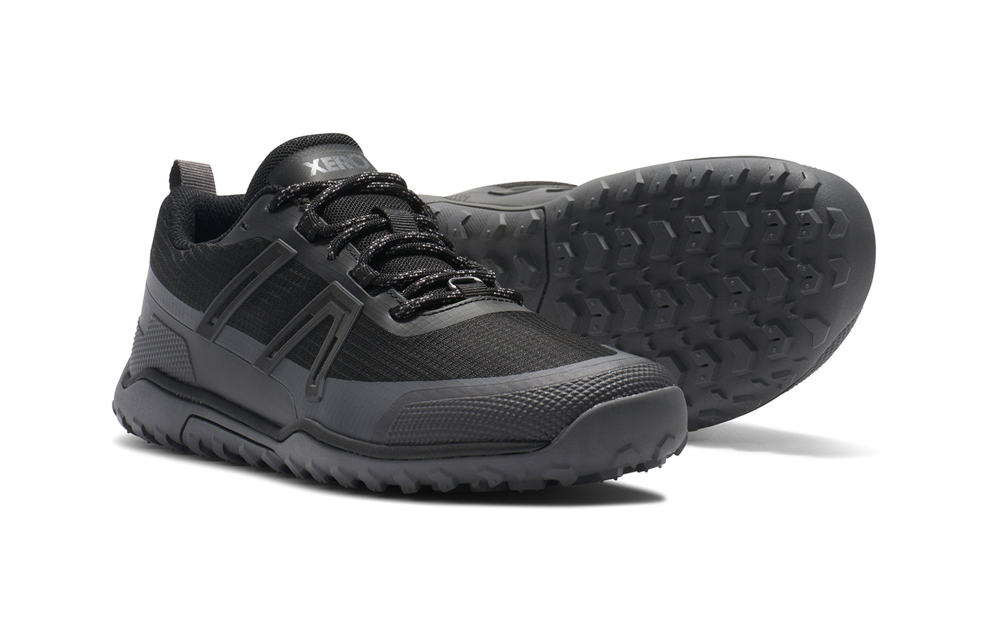Xero Barefoot Shoes sold in Ontario, Canada. These minimalist shoes have flexible soles, wide toe boxes, and zero drop. Side and sole view of Xero Women's Scrambler Trail Low WP in Black/Asphalt - a sturdy hiking shoe