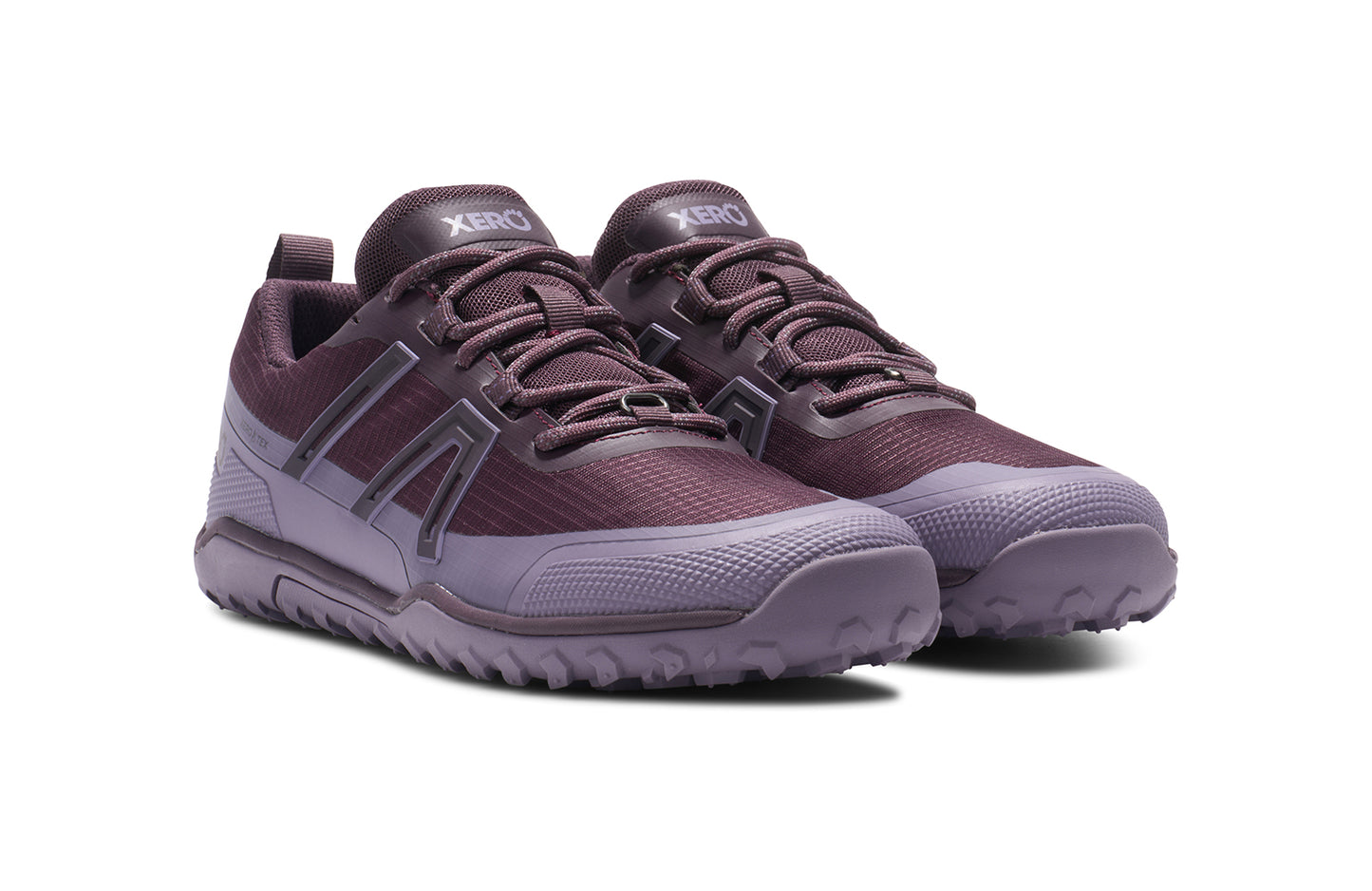 Xero Barefoot Shoes sold in Ontario, Canada. These minimalist shoes have flexible soles, wide toe boxes, and zero drop. Angled view of Xero Women's Scrambler Trail Low WP in Plum Perfect/Sage Purple- a sturdy hiking shoe