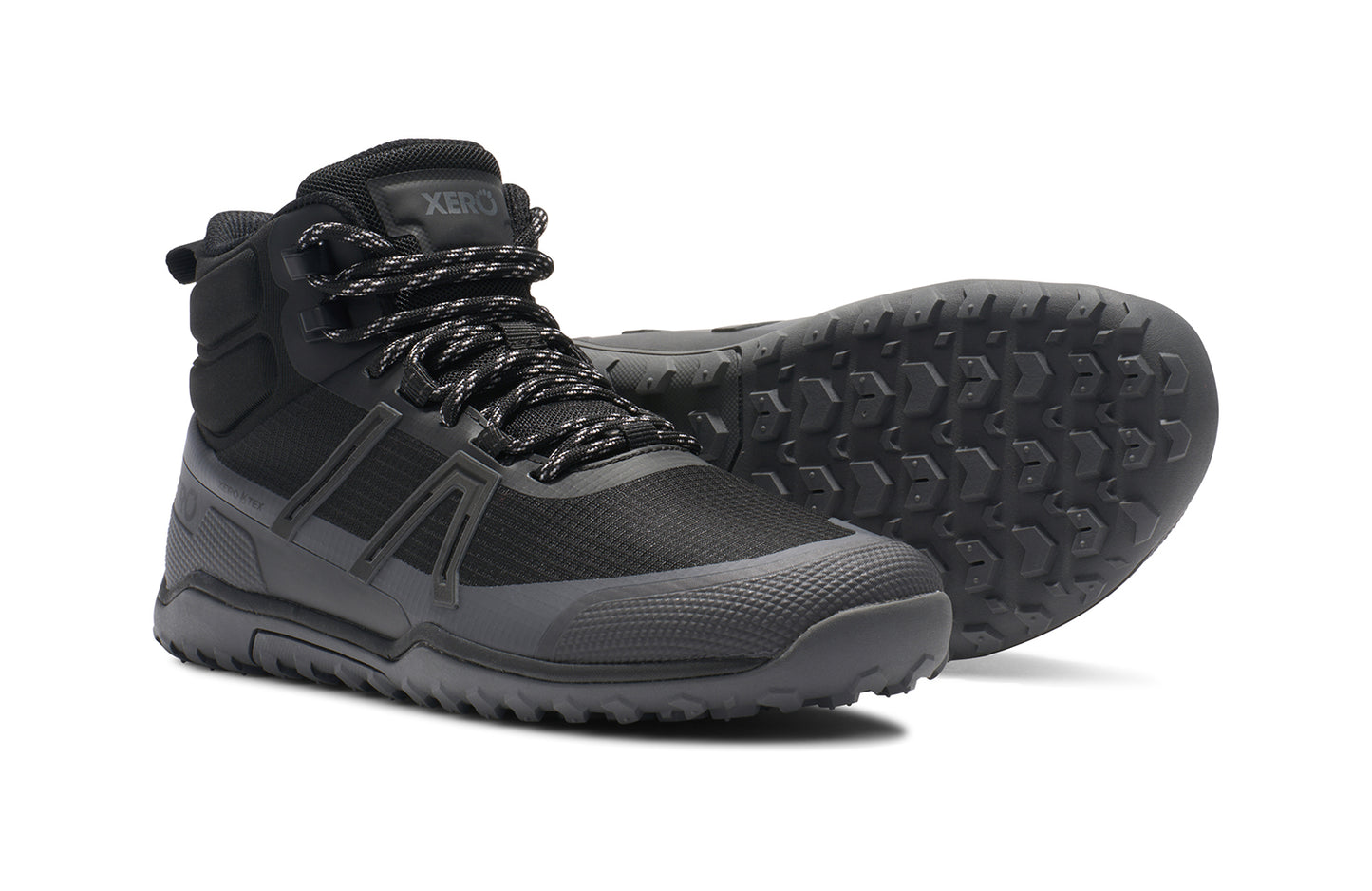 Xero Barefoot Shoes sold in Ontario, Canada. These minimalist shoes have flexible soles, wide toe boxes, and zero drop. Side and sole view of Xero Women's Scrambler Trail Mid WP in Black/Asphalt - a sturdy hiking boot
