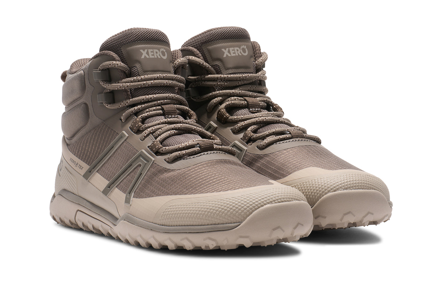 Xero Barefoot Shoes sold in Ontario, Canada. These minimalist shoes have flexible soles, wide toe boxes, and zero drop. Angled view of Xero Women's Scrambler Trail Mid WP in Morel/Pure Cashmere, a sturdy hiking boot