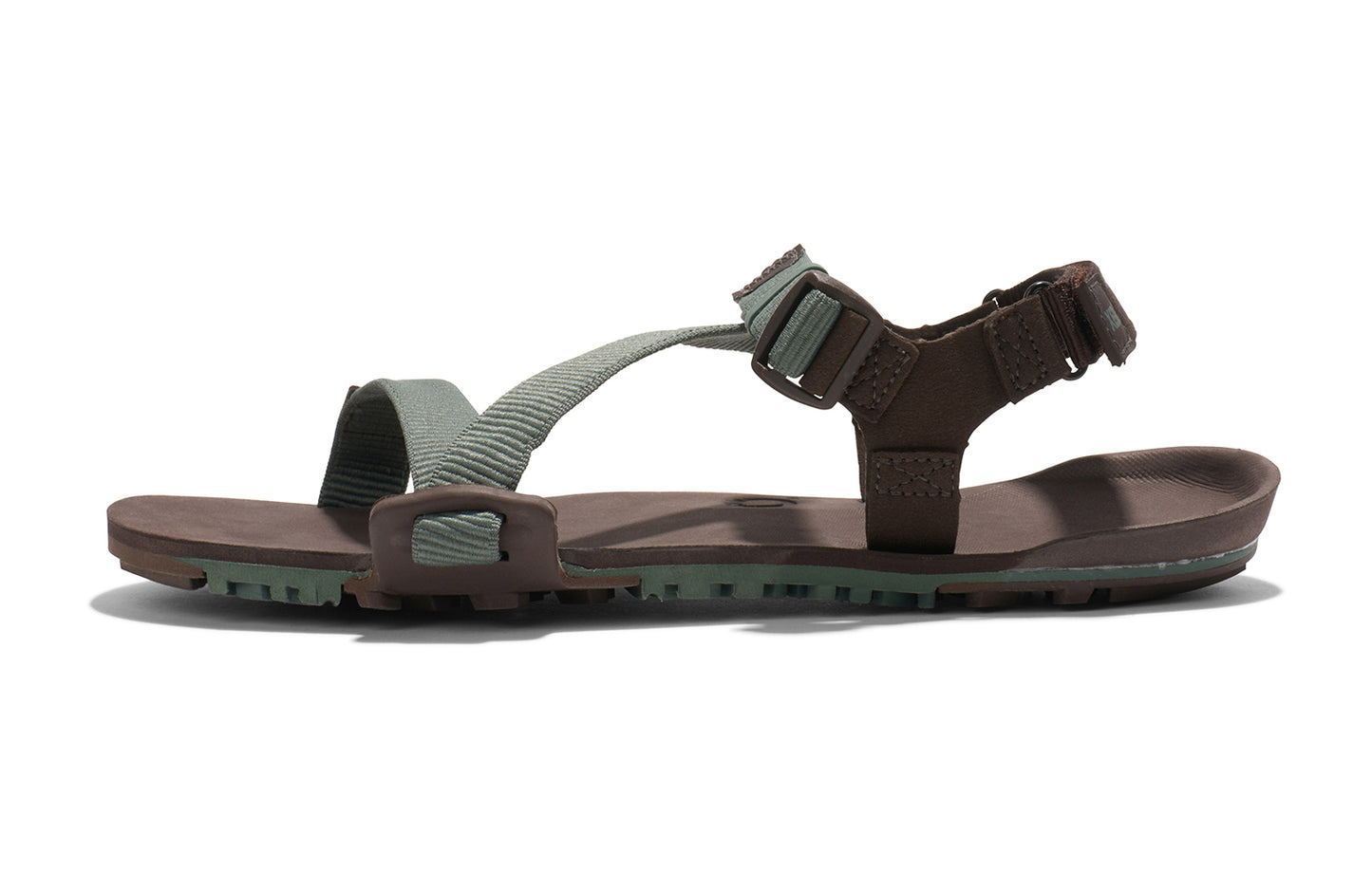 Xero Barefoot Shoes sold in Ontario, Canada. These minimalist shoes have flexible soles, wide toe boxes, and zero drop. Medial side view of Xero Men's Z-Trail EV in Dark Forest/Java Brown. Trail hiking, running, and recovery sandal.