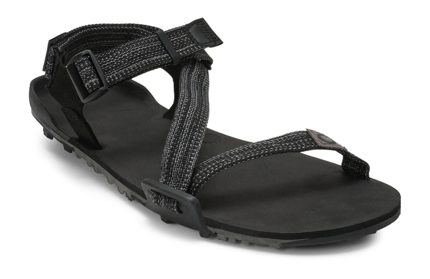 Xero Barefoot Shoes sold in Ontario, Canada. These minimalist shoes have flexible soles, wide toe boxes, and zero drop. Angled view of Xero Men's Z-Trail EV in Multi-Black. Trail hiking, running, and recovery sandal.