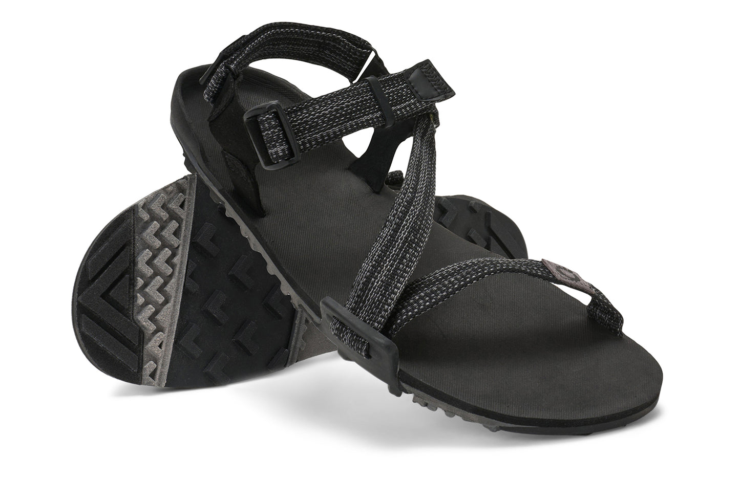 Xero Barefoot Shoes sold in Ontario, Canada. These minimalist shoes have flexible soles, wide toe boxes, and zero drop. Angled pair view of Xero Men's Z-Trail EV in Multi-Black. Trail hiking, running, and recovery sandal.