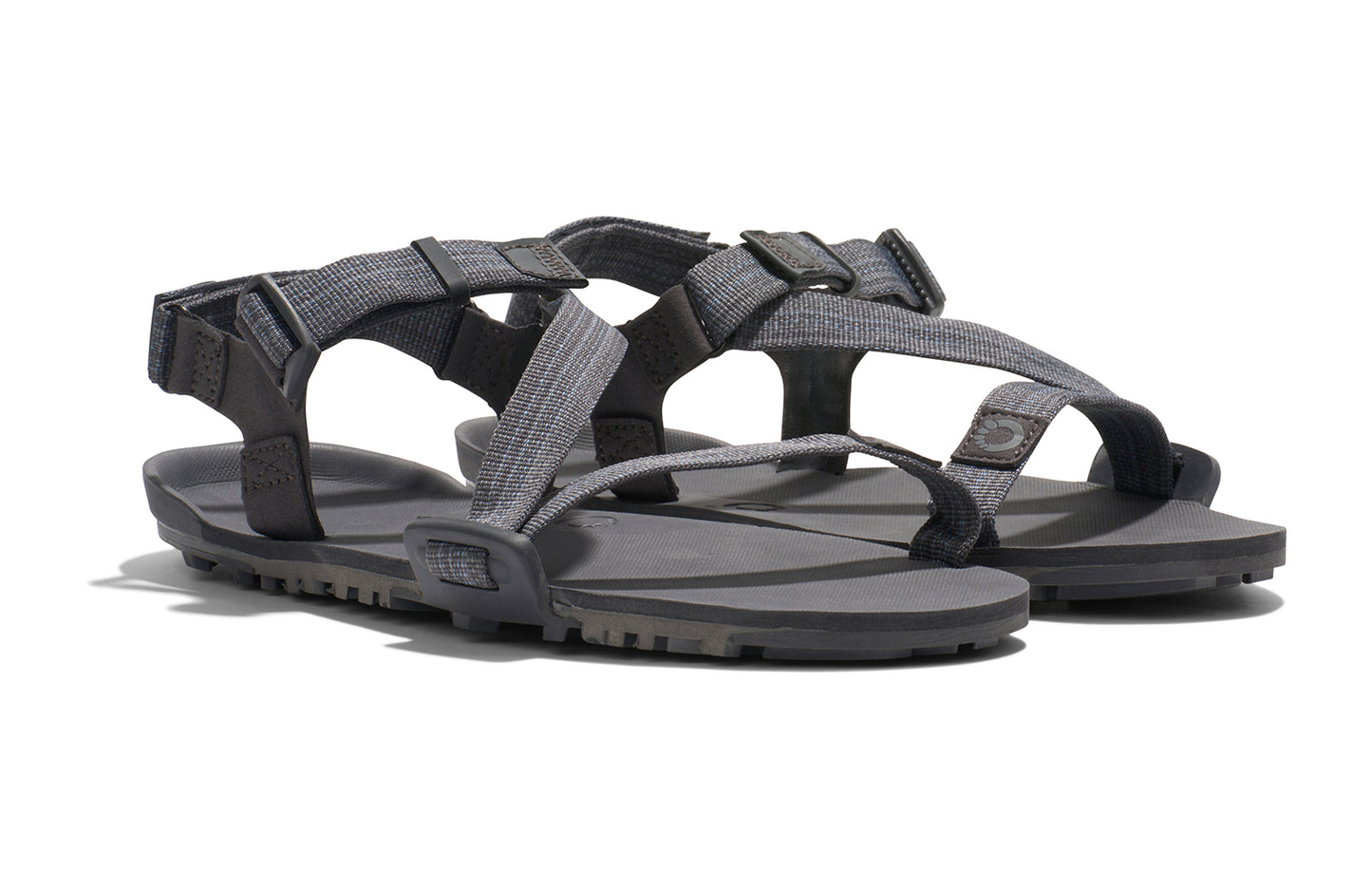 Xero Barefoot Shoes sold in Ontario, Canada. These minimalist shoes have flexible soles, wide toe boxes, and zero drop. Angled view of Xero Men's Z-Trail EV in Steel Gray/Asphalt. Trail hiking, running, and recovery sandal.