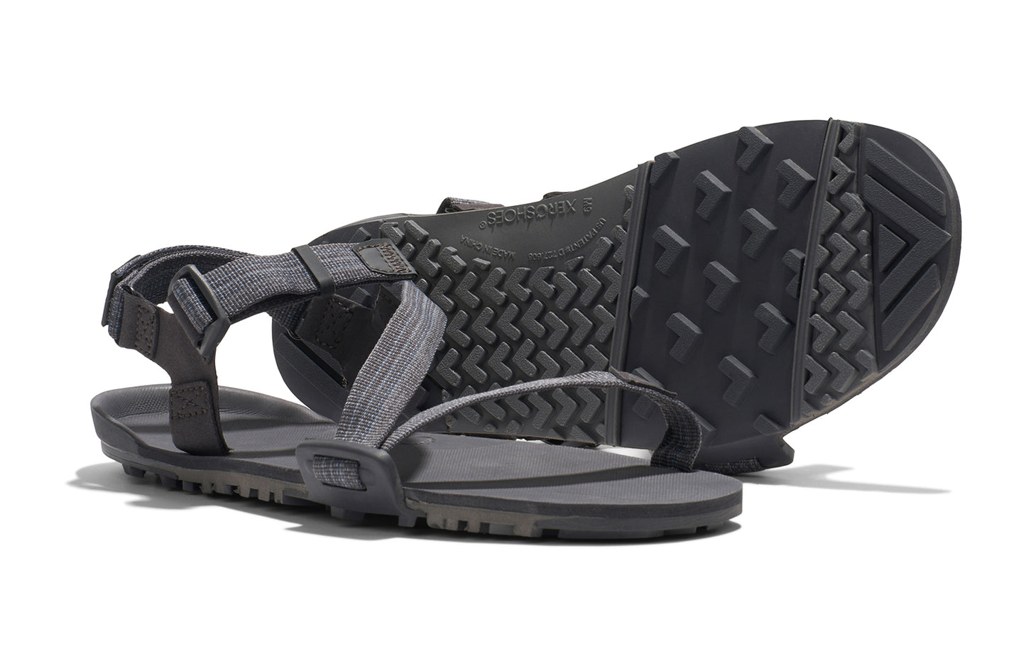 Xero Barefoot Shoes sold in Ontario, Canada. These minimalist shoes have flexible soles, wide toe boxes, and zero drop. Side and sole pair view of Xero Men's Z-Trail EV in Steel Gray/Asphalt. Trail hiking, running, and recovery sandal.