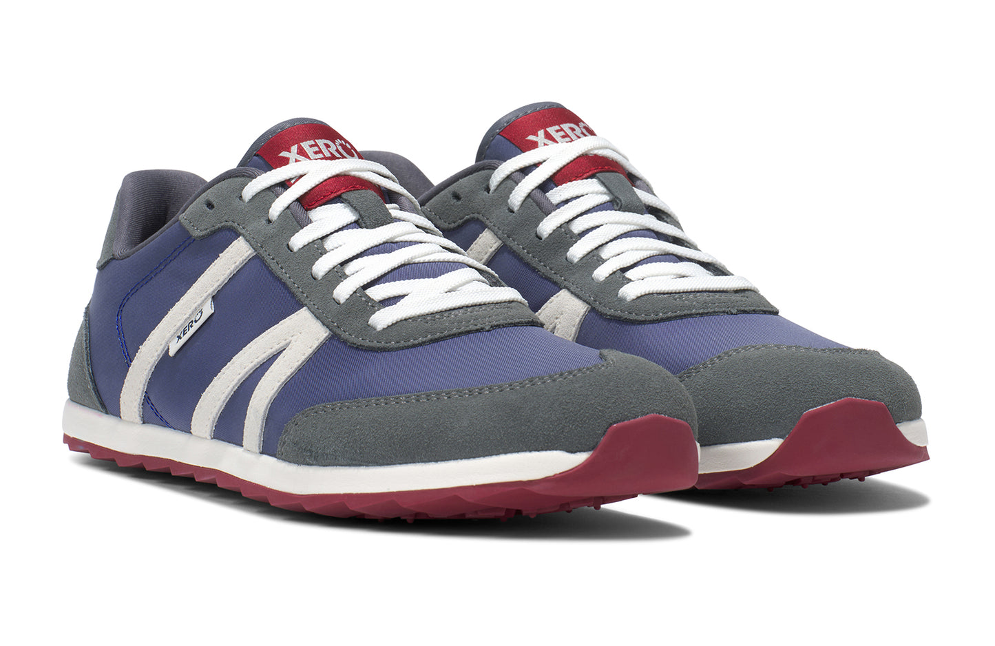 Xero Barefoot Shoes sold in Ontario, Canada. These minimalist shoes have flexible soles, wide toe boxes, and zero drop. Side view of Xero Men's Wynn in Blue Gray Red, a casual sneaker