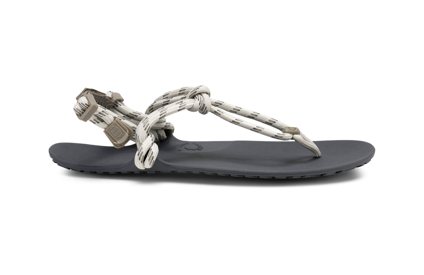 Xero Shoes Canada, specifically women’s barefoot shoes Canada. These minimalist shoes have flexible soles, wide toe boxes, and zero drop. Lateral side view of Xero Women's Genesis in Stone. Lightweight, packable, travel-friendly sandal.