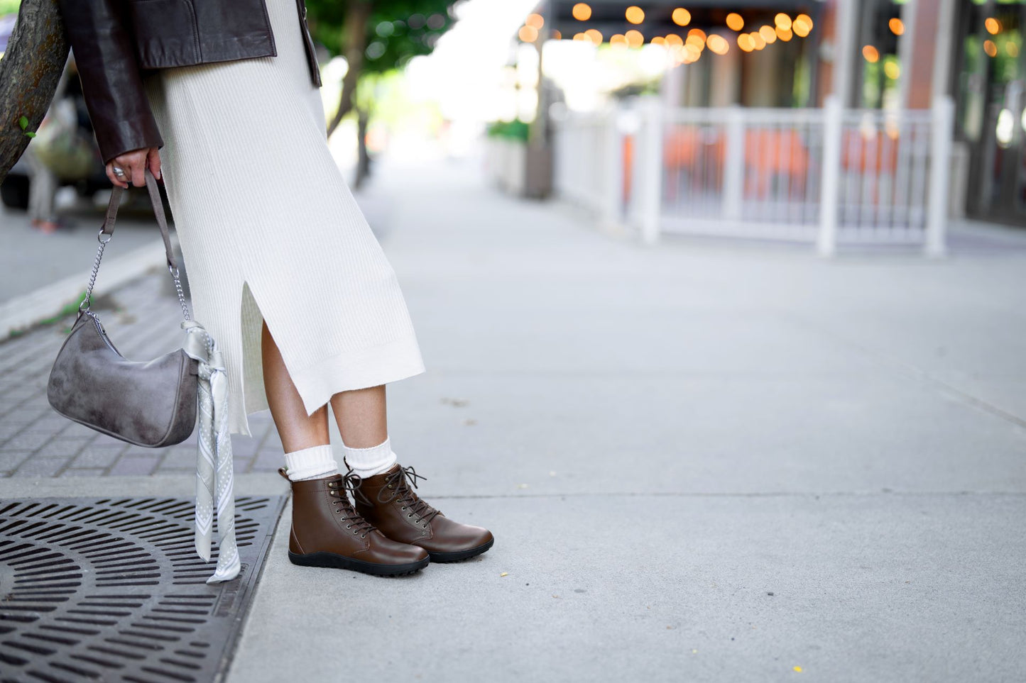 Xero shoes Canada, woman wearing Breckenridge with a skirt in town