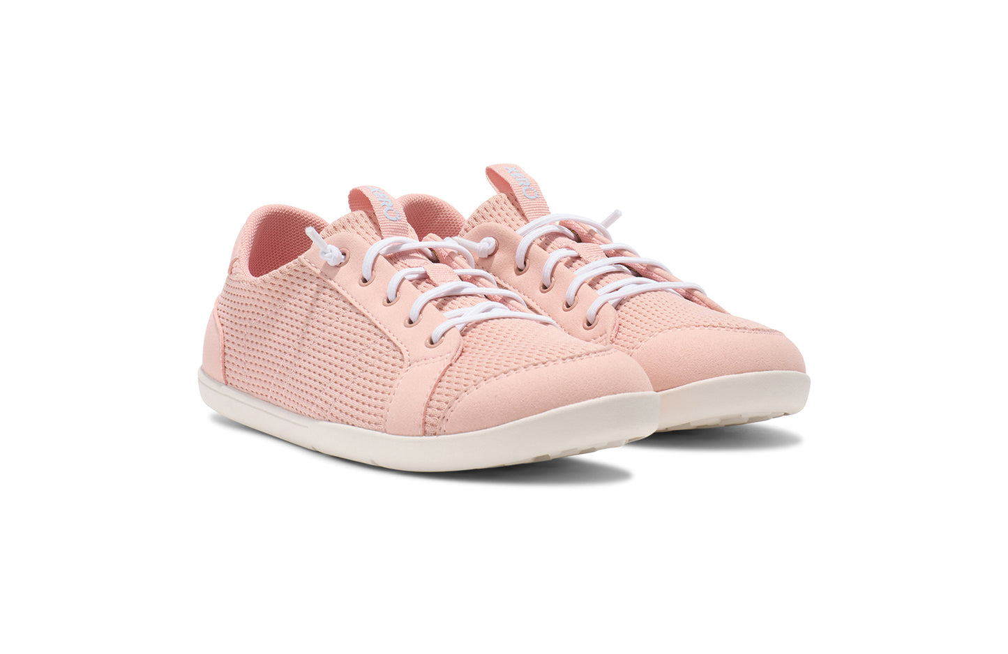 Xero Shoes Canada, barefoot shoes for kids. These minimalist shoes have flexible soles, wide toe boxes, and zero drop. Angled view of Xero Big Kid's Dillon in Pink Sand, a classic sneaker.