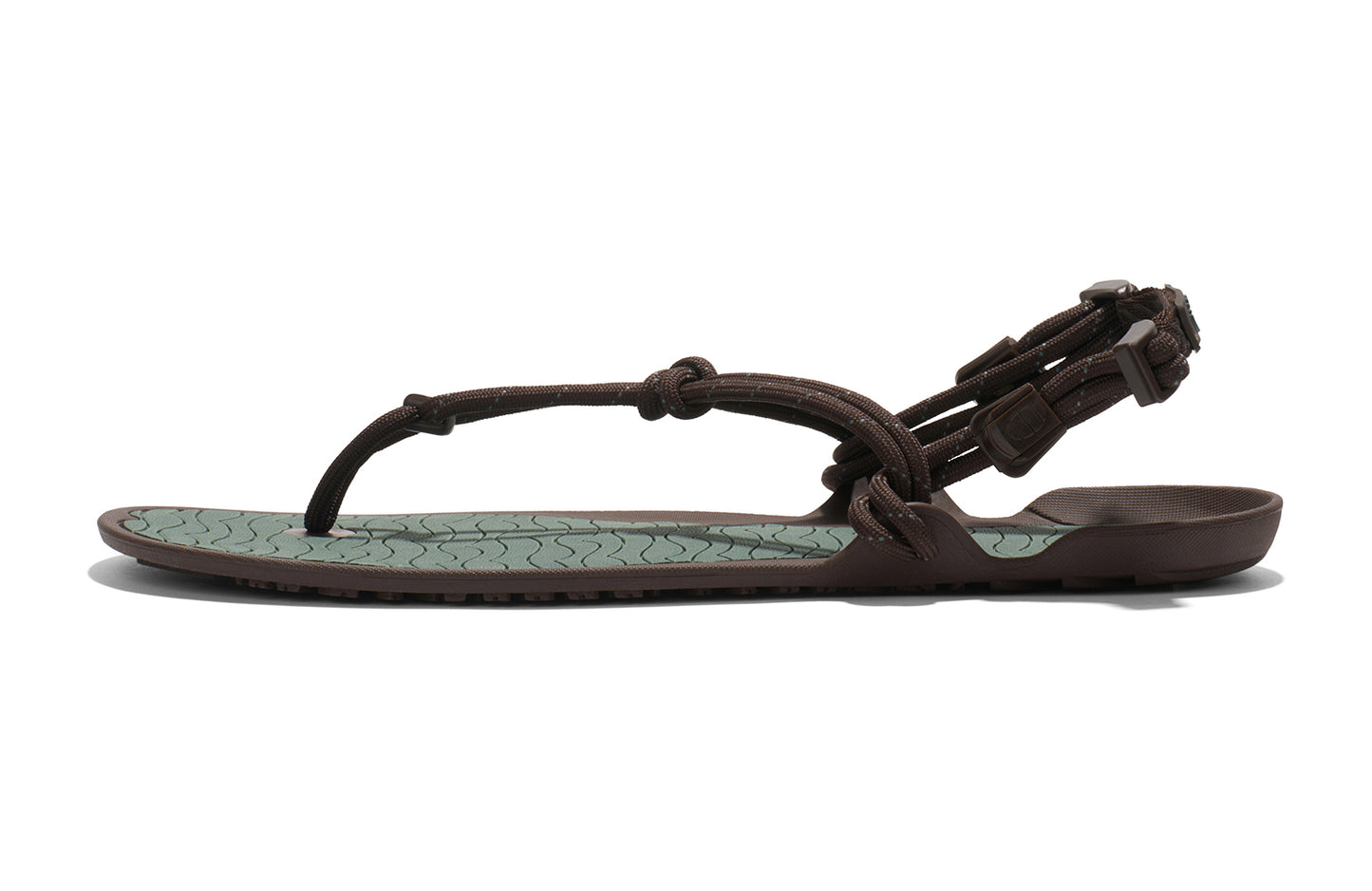 Xero Shoes Canada, specifically men’s barefoot shoes Canada. These minimalist shoes have flexible soles, wide toe boxes, and zero drop. Medial side view of Xero Men's Aqua Cloud in Java Brown/Dark Forest. Versatile water sport and hiking sandal.
