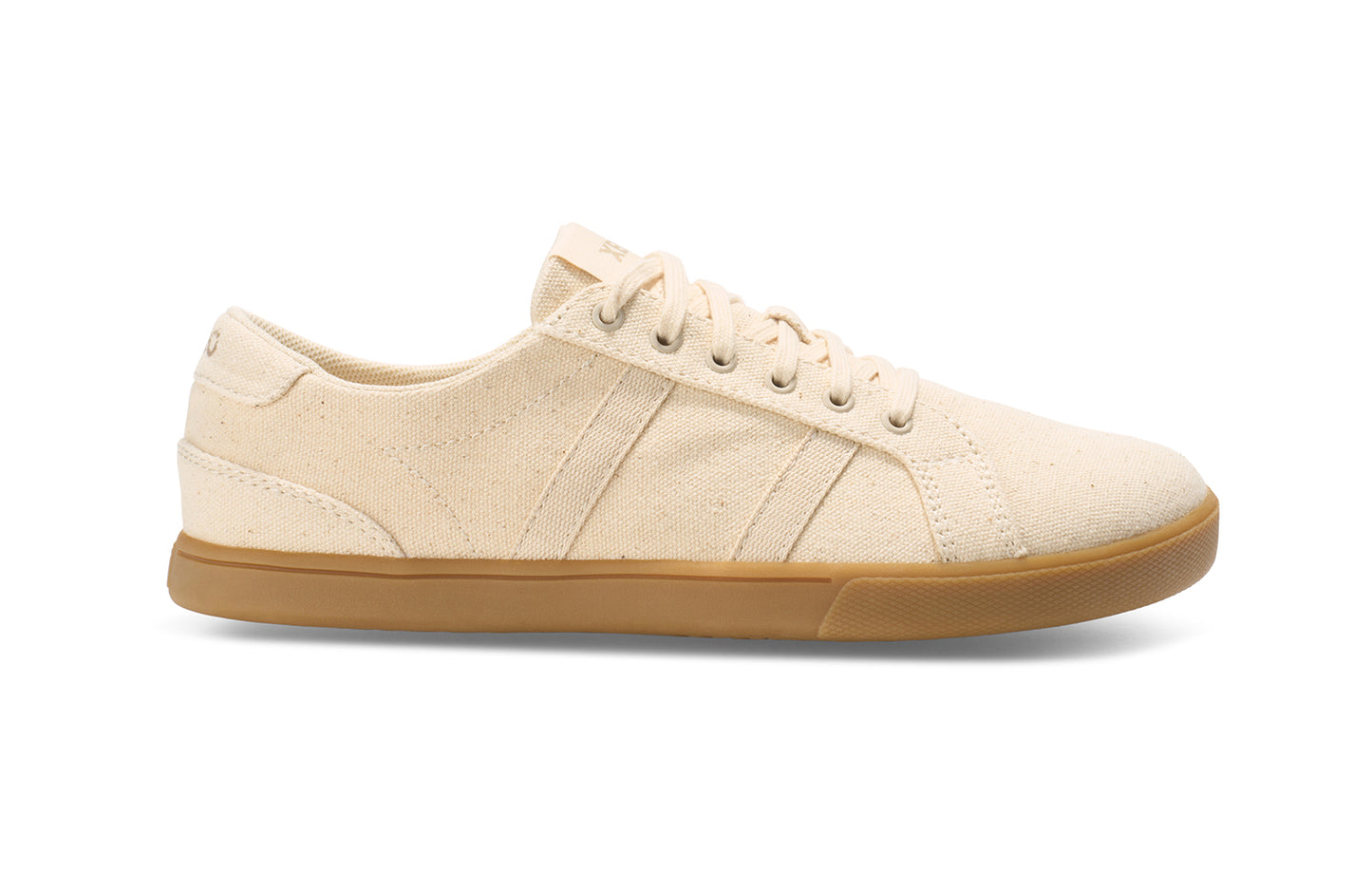 Xero Shoes Canada, specifically men’s barefoot shoes Canada. These minimalist shoes have flexible soles, wide toe boxes, and zero drop. Side view of Xero Men's Dillon Canvas in Natural Gum, a classic sneaker.