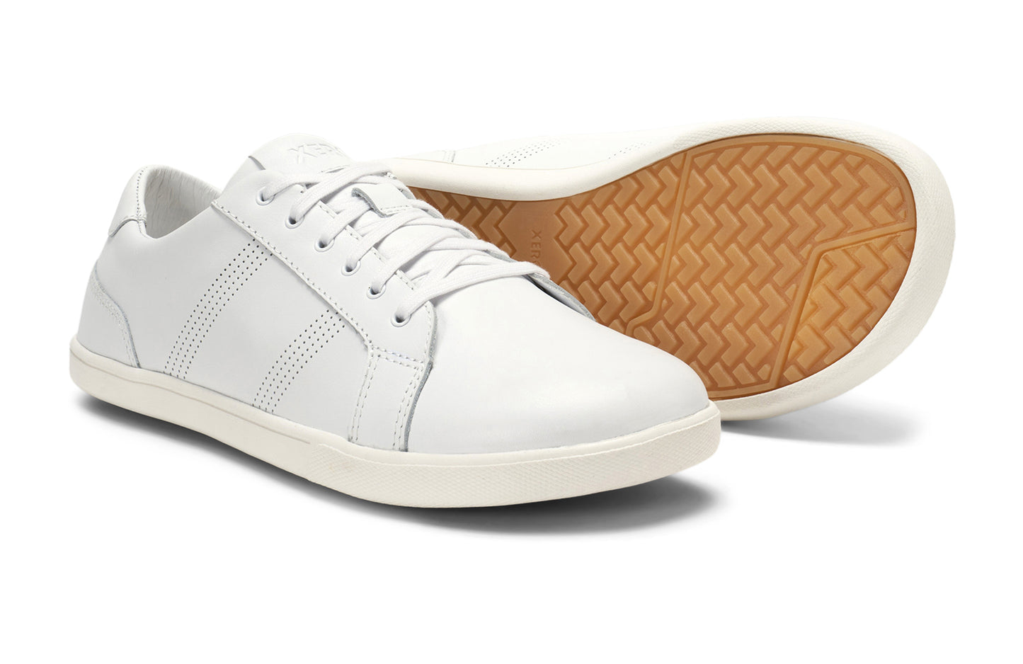 Xero Shoes Canada, specifically men’s barefoot shoes Canada. These minimalist shoes have flexible soles, wide toe boxes, and zero drop. Pair view of Men's Dillon Leather in White. A classic leather sneaker.