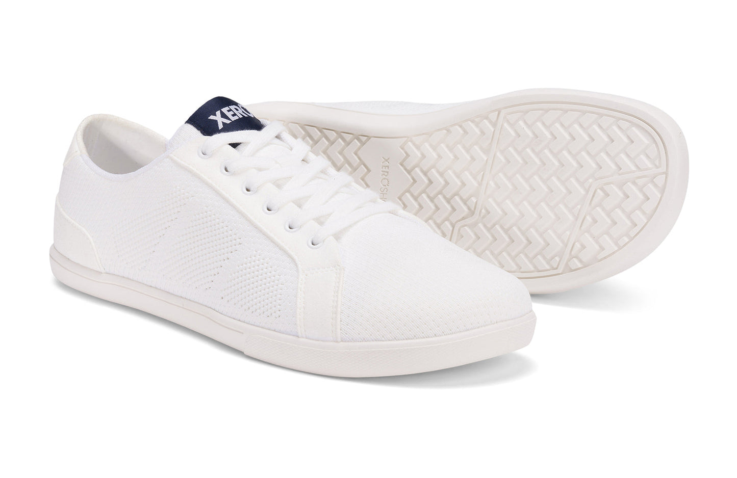 Xero Shoes Canada, specifically men’s barefoot shoes Canada. These minimalist shoes have flexible soles, wide toe boxes, and zero drop. Pair view of Xero Men's Dillon in White. Classic, casual sneaker