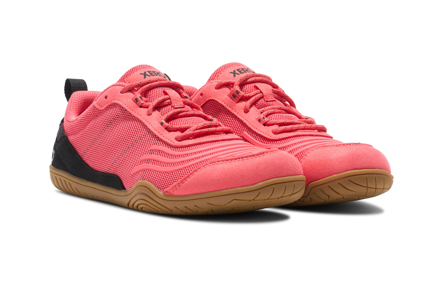 Xero Shoes Canada, specifically barefoot running shoes Canada. These minimalist shoes have flexible soles, wide toe boxes, and zero drop. Angled view of Xero Women's 360s in Sunset Coral/Black Gum. A cross-training shoe.