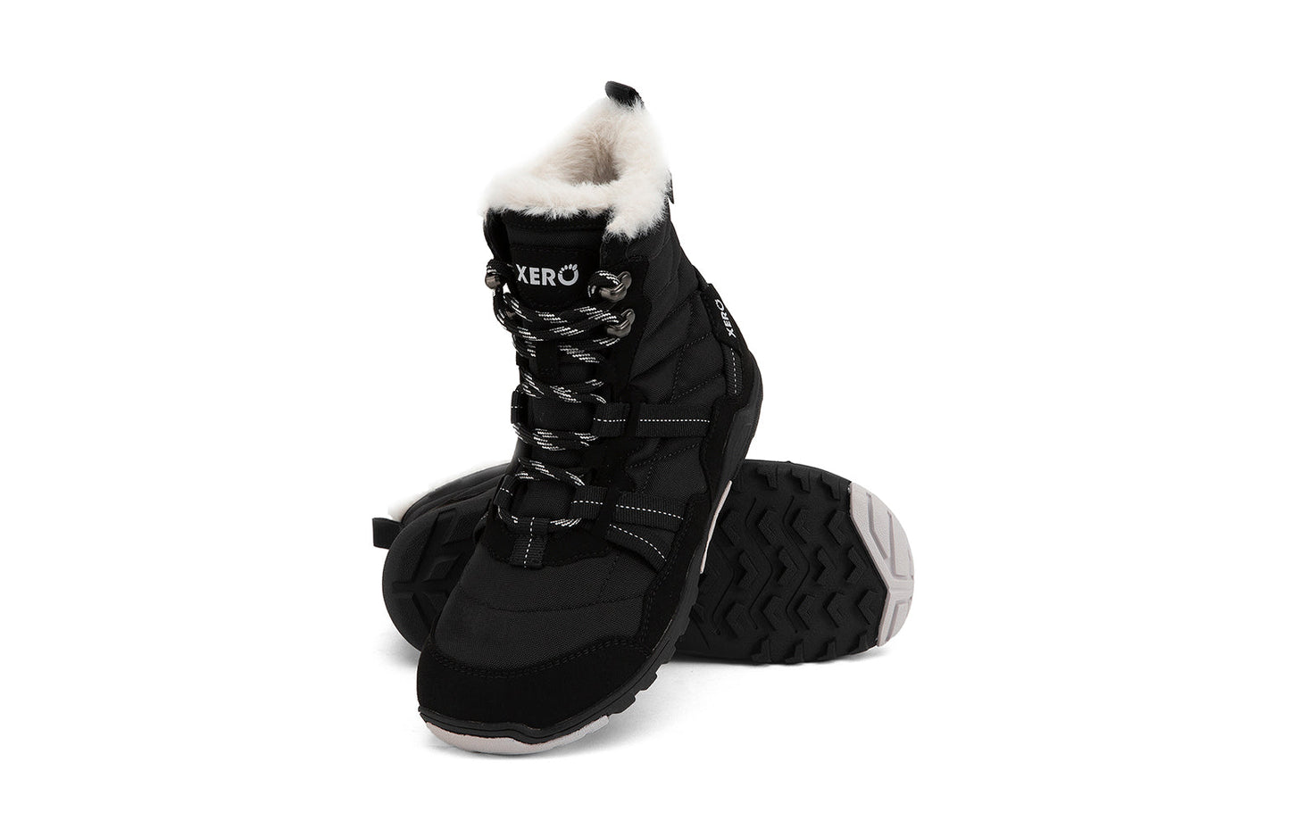 Xero Shoes Canada, specifically women’s barefoot shoes Canada. These minimalist shoes have flexible soles, wide toe boxes, and zero drop. Angled pair view of Xero Women's Alpine in Black. Waterproof, lightweight snow boot.