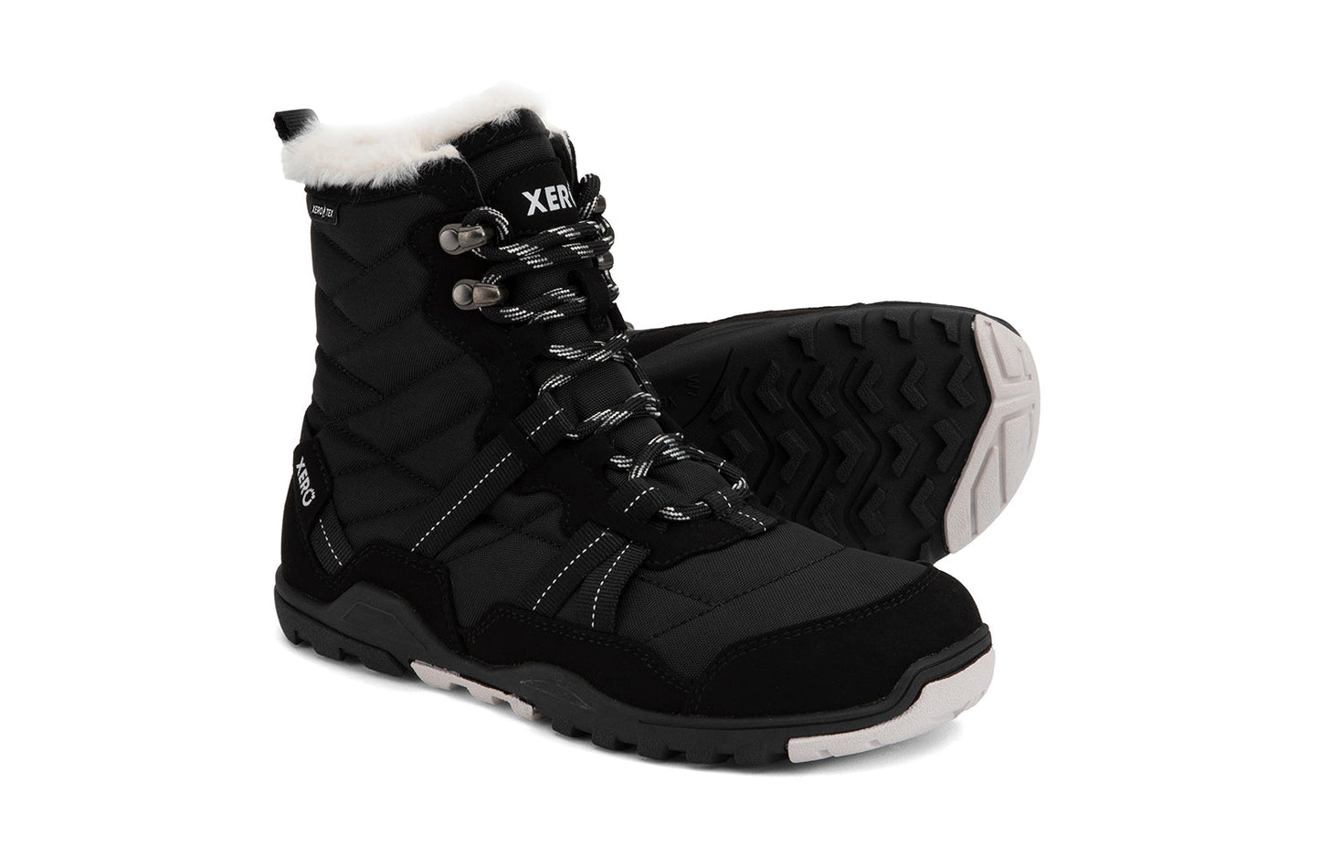 Xero Shoes Canada, specifically women’s barefoot shoes Canada. These minimalist shoes have flexible soles, wide toe boxes, and zero drop. Side and sole pair view of Xero Women's Alpine in Black. Waterproof, lightweight snow boot.