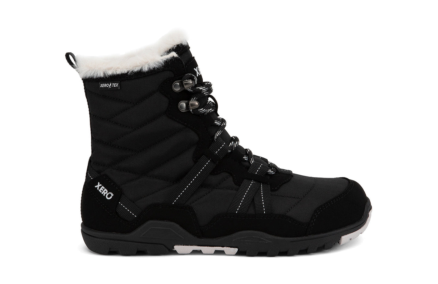Xero Shoes Canada, specifically women’s barefoot shoes Canada. These minimalist shoes have flexible soles, wide toe boxes, and zero drop. Lateral side view of Xero Women's Alpine in Black. Waterproof, lightweight snow boot.