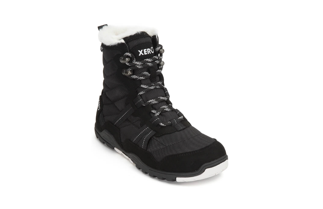 Xero Shoes Canada, specifically women’s barefoot shoes Canada. These minimalist shoes have flexible soles, wide toe boxes, and zero drop. Angled view of Xero Women's Alpine in Black. Waterproof, lightweight snow boot.