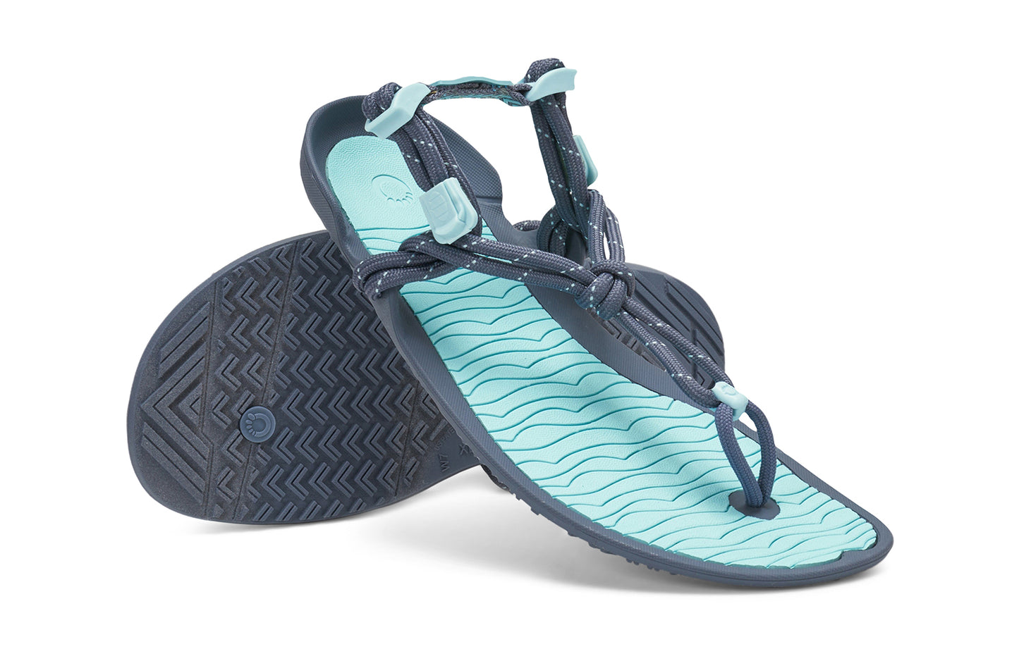 Xero Shoes Canada, specifically women’s barefoot shoes Canada. These minimalist shoes have flexible soles, wide toe boxes, and zero drop. Angled pair view of Xero Women's Aqua Cloud in Blue Glow. Versatile water sport and hiking sandal.