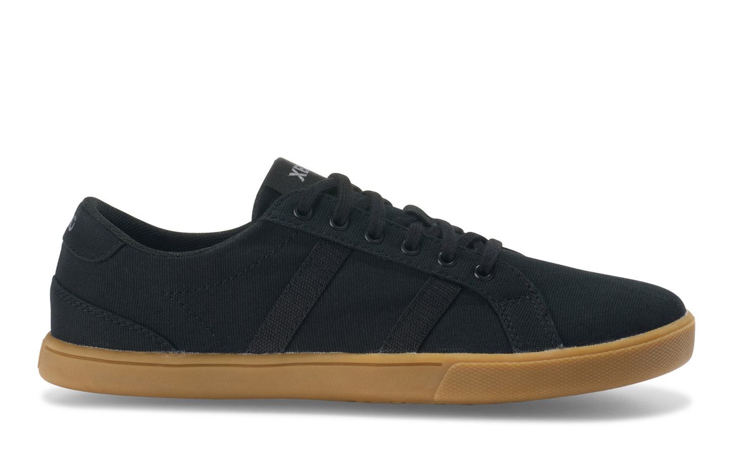 Xero Shoes Canada, specifically women’s barefoot shoes Canada. These minimalist shoes have flexible soles, wide toe boxes, and zero drop. Side view of Xero Women's Dillon Canvas in Black Gum, a classic sneaker.