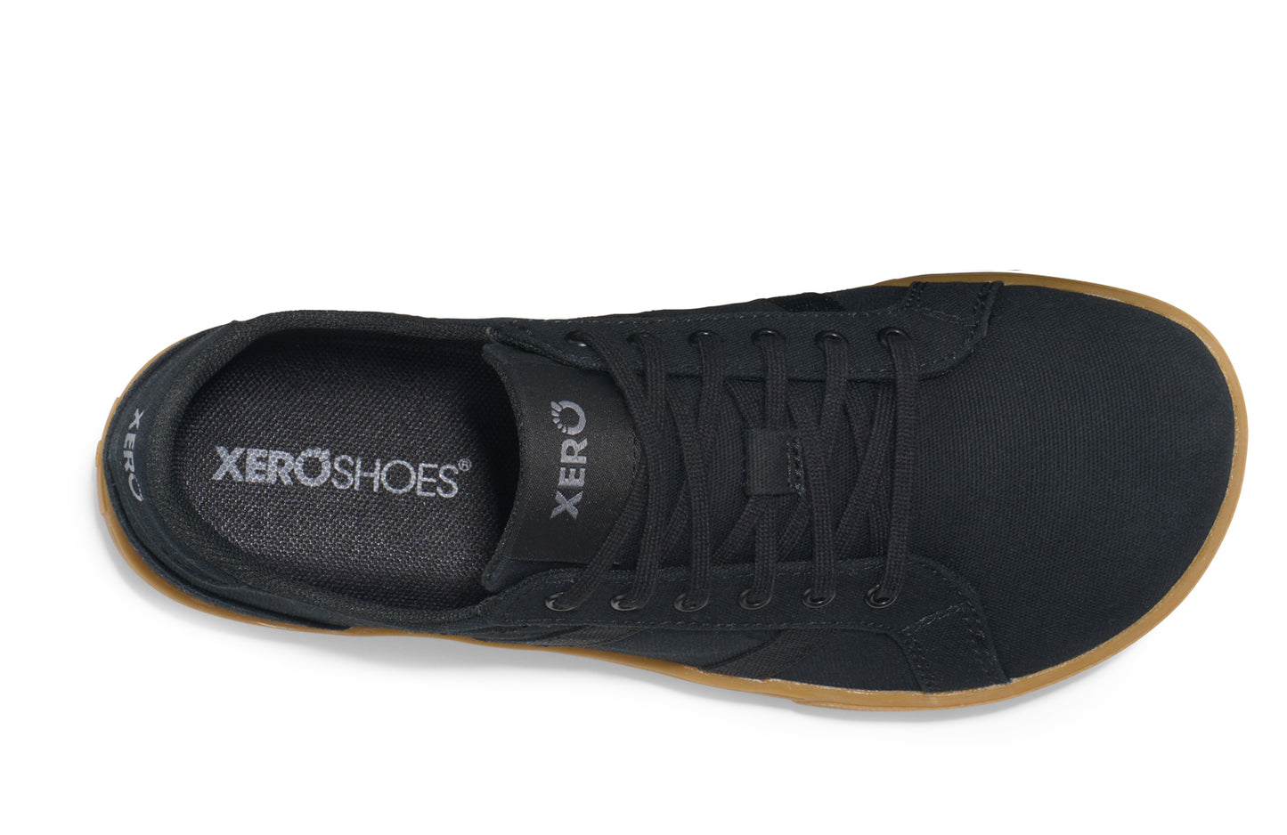 Xero Shoes Canada, specifically women’s barefoot shoes Canada. These minimalist shoes have flexible soles, wide toe boxes, and zero drop. Top view of Xero Women's Dillon Canvas in Black Gum, a classic sneaker.