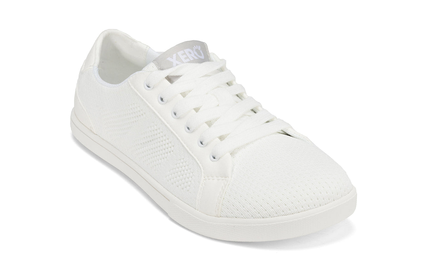 Xero Shoes Canada, specifically women’s barefoot shoes Canada. These minimalist shoes have flexible soles, wide toe boxes, and zero drop. Angled view of Xero Women's Dillon in White. Classic, casual sneaker