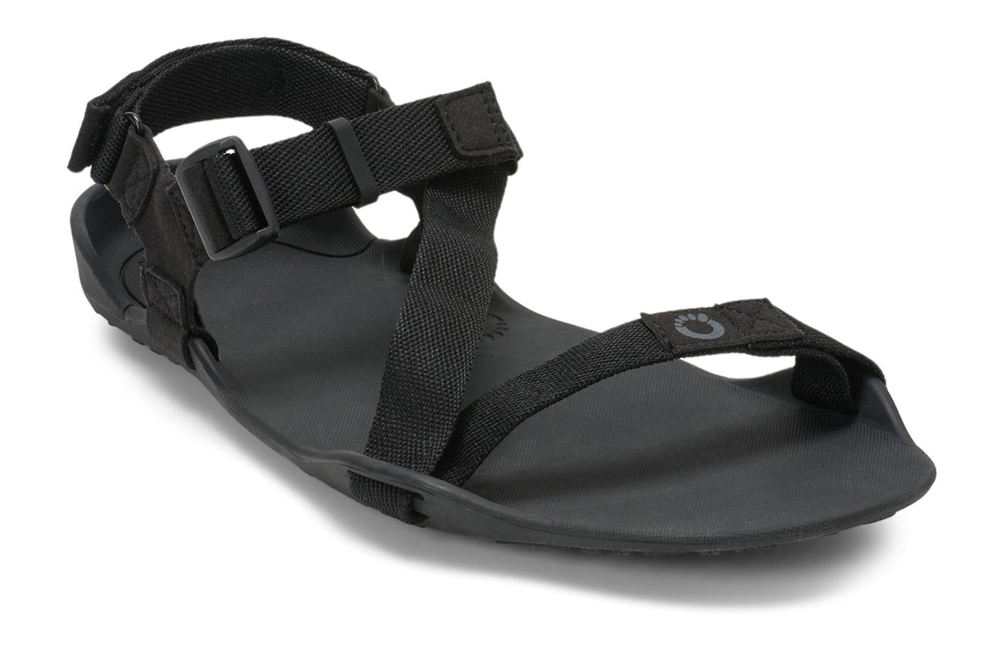 Xero Barefoot Shoes sold in Ontario, Canada. These minimalist shoes have flexible soles, wide toe boxes, and zero drop. Angled view of Xero Men's Z-Trek in Black, a lightweight packable sport sandal.
