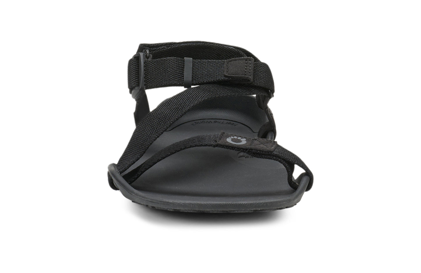 Xero Barefoot Shoes sold in Ontario, Canada. These minimalist shoes have flexible soles, wide toe boxes, and zero drop. Front view of Xero Men's Z-Trek in Black, a lightweight packable sport sandal.