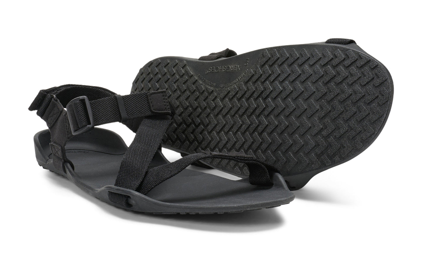 Xero Barefoot Shoes sold in Ontario, Canada. These minimalist shoes have flexible soles, wide toe boxes, and zero drop. Pair view of Xero Men's Z-Trek in Black, a lightweight packable sport sandal.