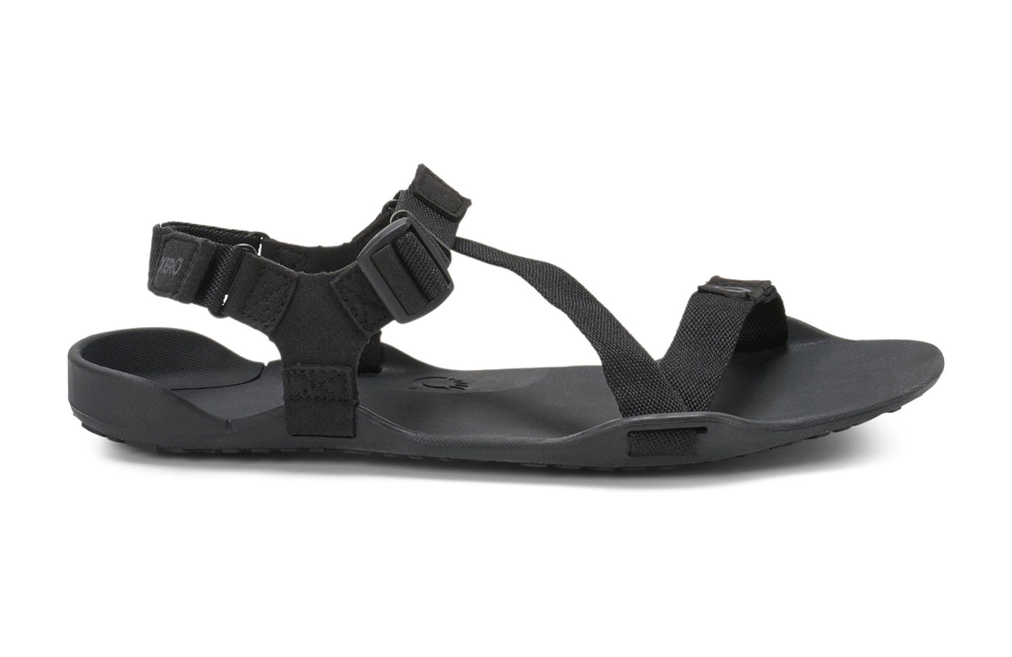 Xero Barefoot Shoes sold in Ontario, Canada. These minimalist shoes have flexible soles, wide toe boxes, and zero drop. Lateral side view of Xero Men's Z-Trek in Black, a lightweight packable sport sandal.